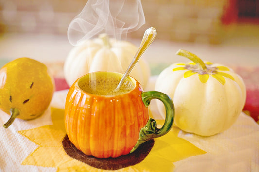 Pumpkin Coffee Mug With Coffee On The Table